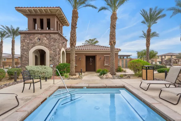 a view of a house with couches yard and swimming pool