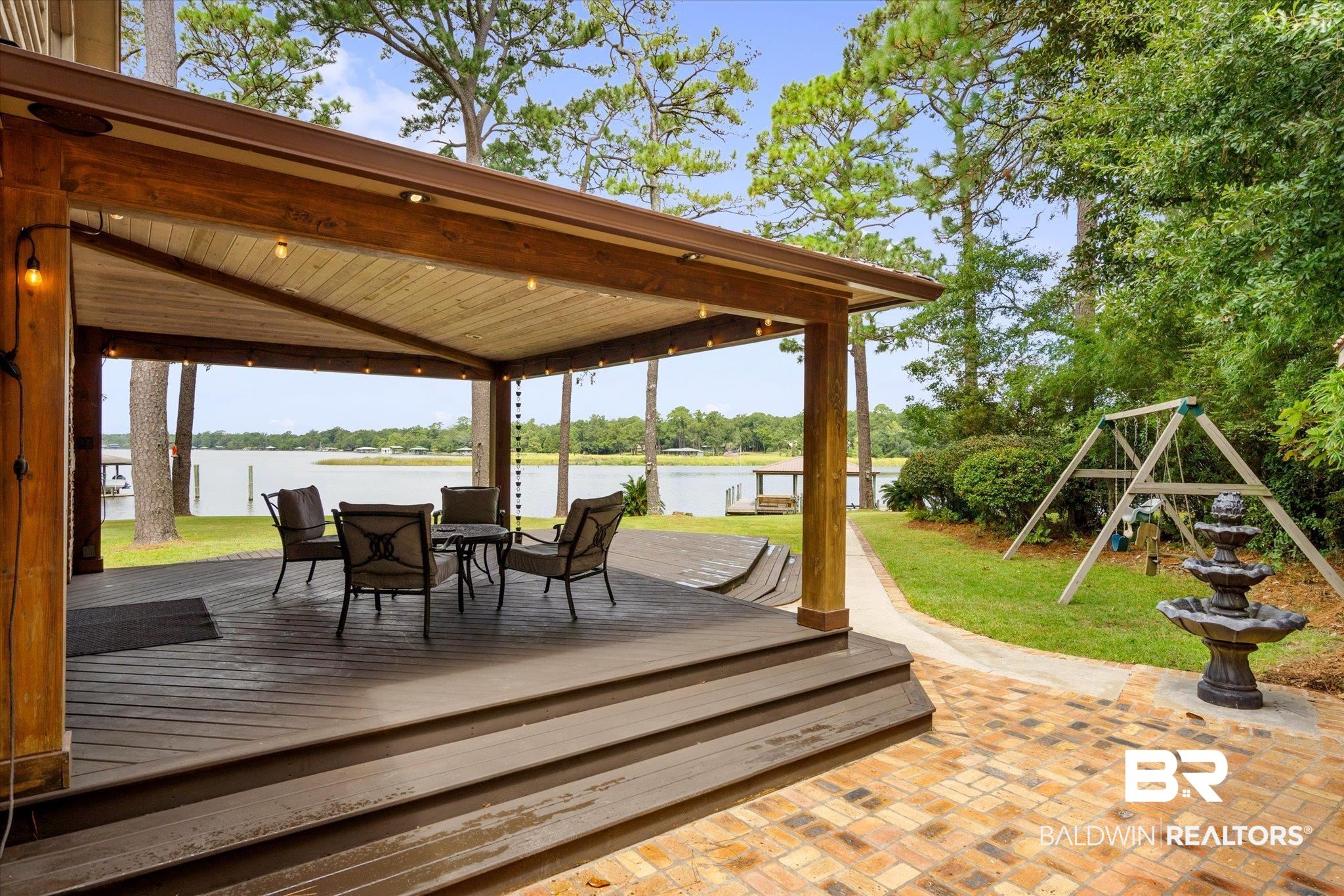 2228 Riverside Drive Mobile, AL 36605 - Photo 8 of 51 Wooden deck featuring a gazebo, a lawn, a water view, and a playground