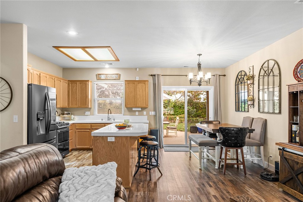 1563 Champlain Way Chico, CA 95973 - Photo 13 of 49 a view of a dining room with furniture window and outside view