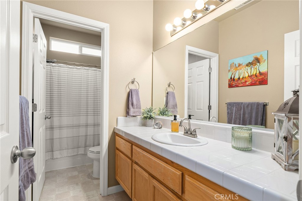 1563 Champlain Way Chico, CA 95973 - Photo 19 of 49 a bathroom with a sink and a mirror