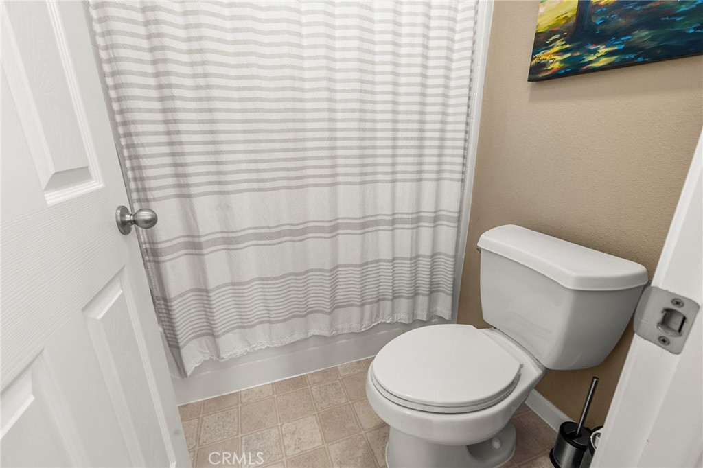 1563 Champlain Way Chico, CA 95973 - Photo 20 of 49 a white toilet sitting next to a shower
