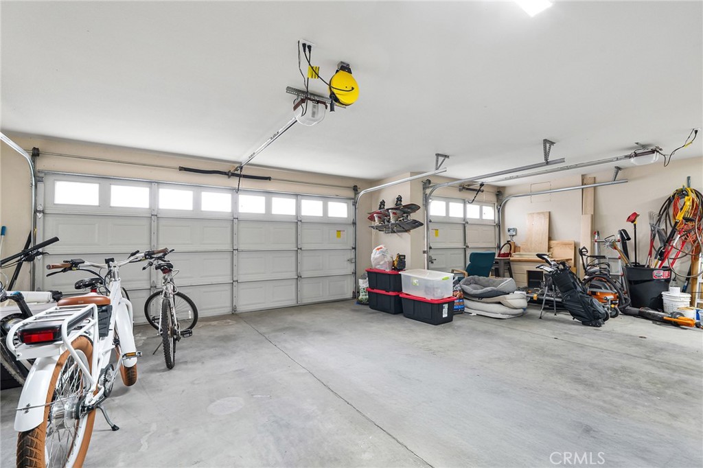 1563 Champlain Way Chico, CA 95973 - Photo 30 of 49 a garage with furniture and a ceiling fan