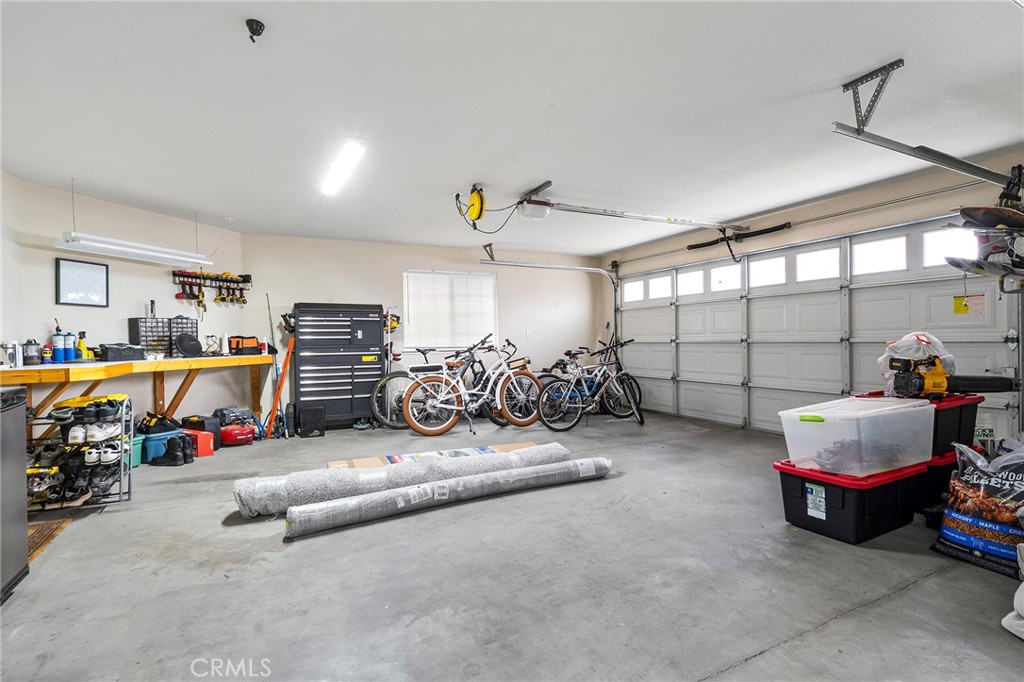 1563 Champlain Way Chico, CA 95973 - Photo 31 of 49 a view of a garage with a couch and a ceiling fan