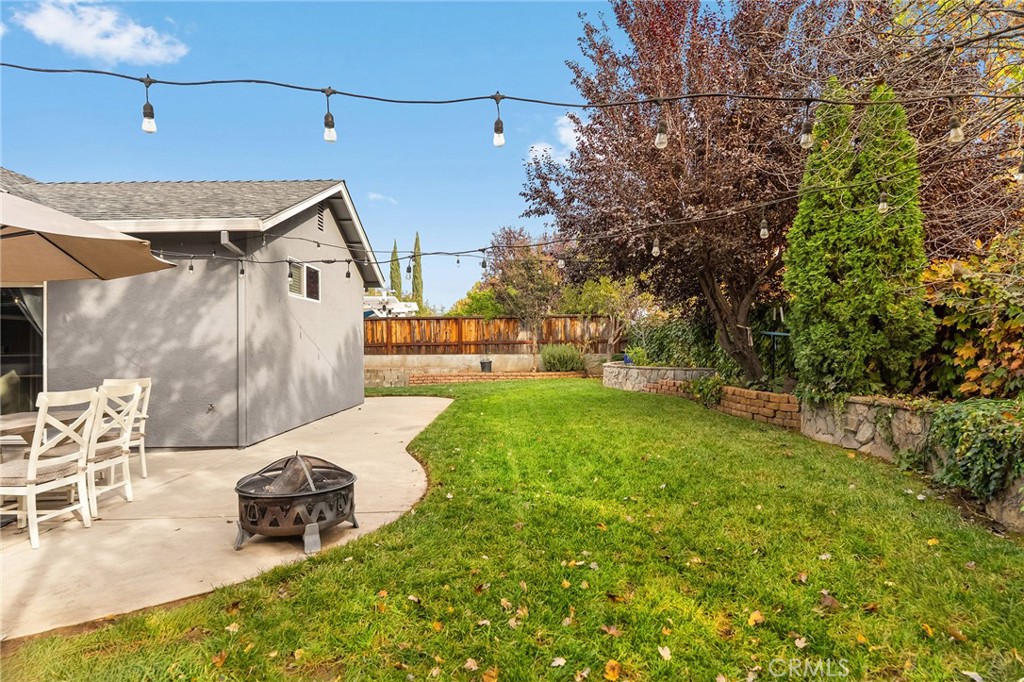 1563 Champlain Way Chico, CA 95973 - Photo 37 of 49 a view of a chair and table in backyard