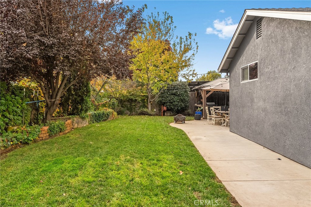 1563 Champlain Way Chico, CA 95973 - Photo 40 of 49 a view of a backyard with sitting area