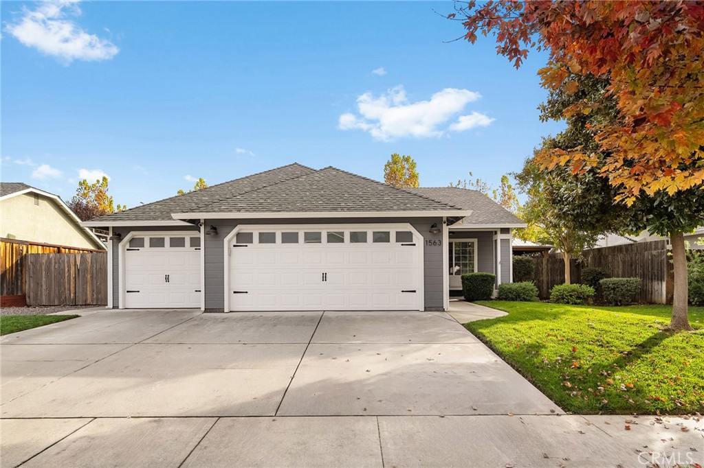 1563 Champlain Way Chico, CA 95973 - Photo 8 of 49 a view of a house with a yard