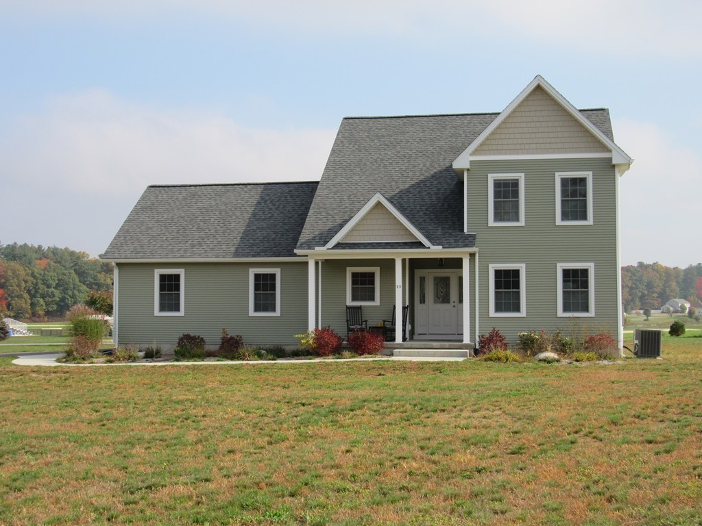 33 Strong Road Southampton, MA 01073 - Photo 5 of 18 a front view of house with yard and trees in the background