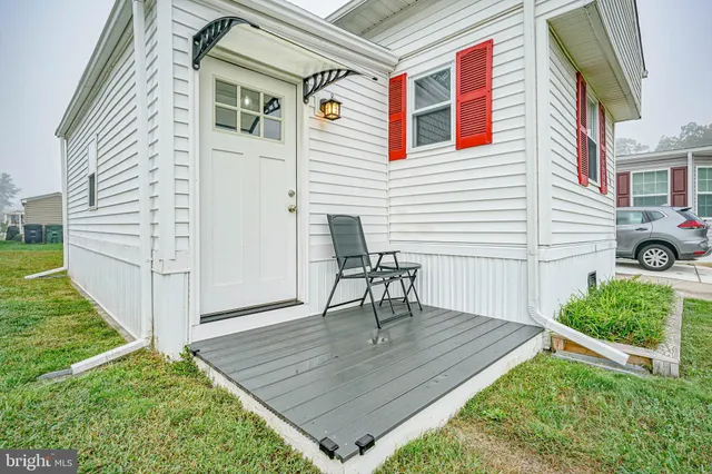 a view of a backyard with sitting area