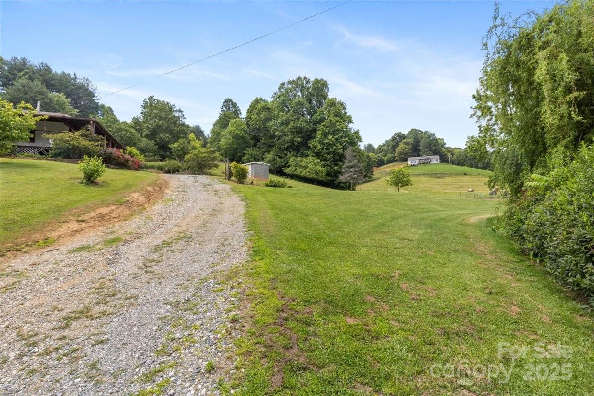 461 Tweed Road Marshall, NC 28753 - Photo 11 of 29 a yard with lake view