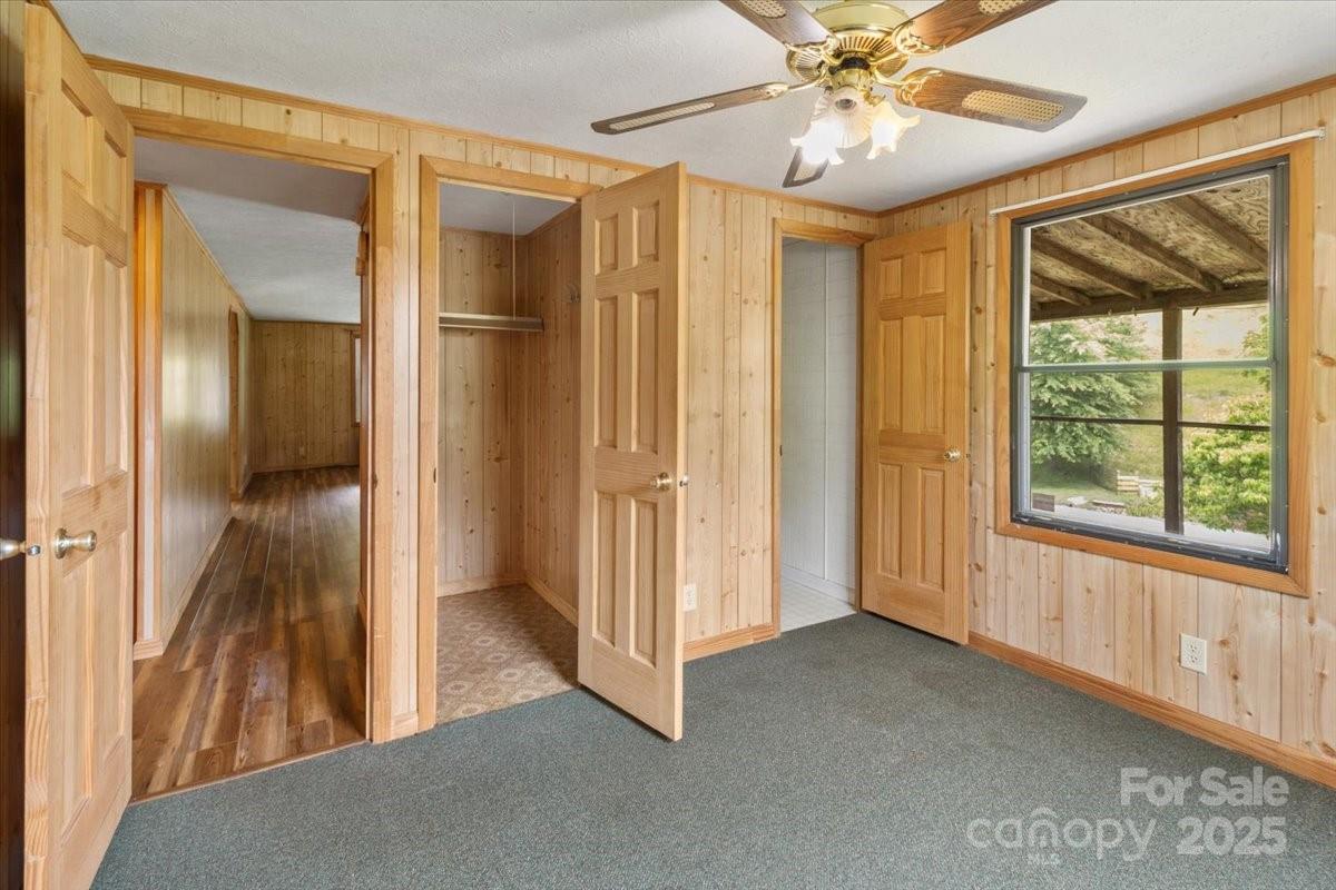 461 Tweed Road Marshall, NC 28753 - Photo 19 of 29 a view of hallway with a large window and chandelier fan