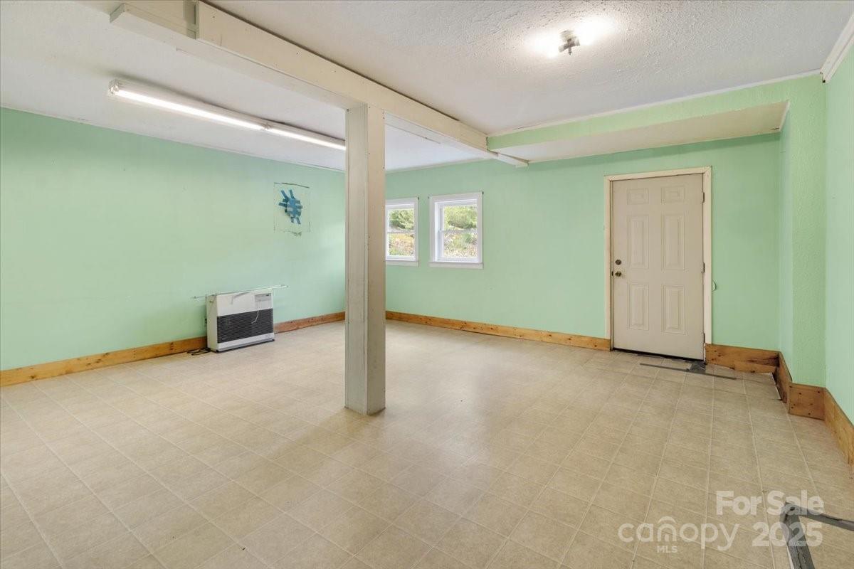 461 Tweed Road Marshall, NC 28753 - Photo 24 of 29 an empty room with windows