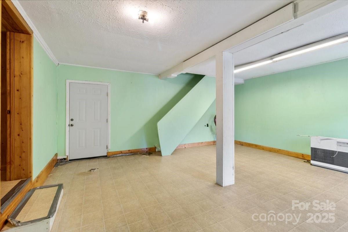 461 Tweed Road Marshall, NC 28753 - Photo 25 of 29 a view of an empty room