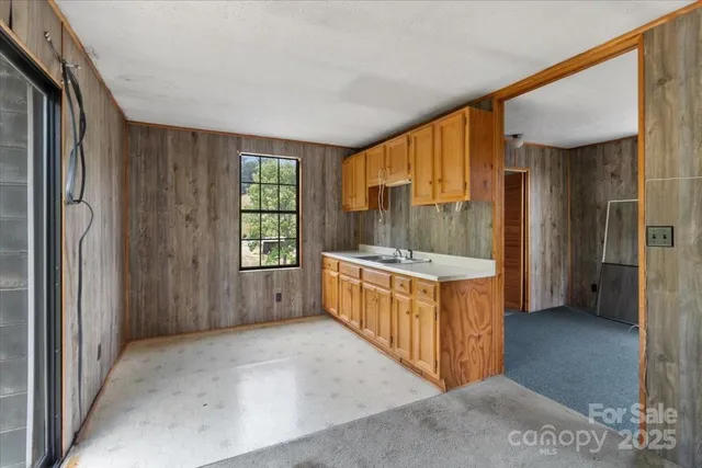 a view of an entryway with a tub and windows