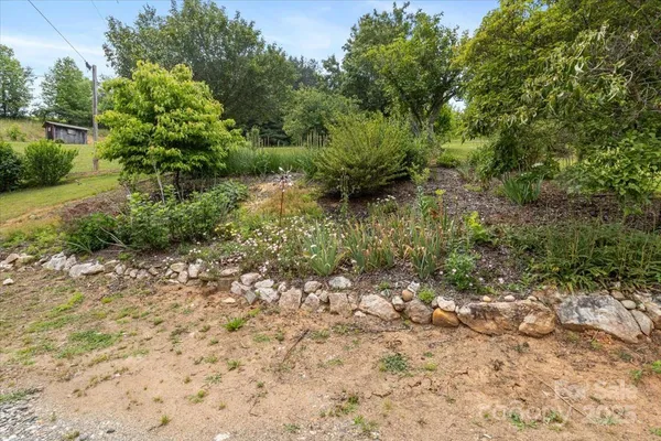 a backyard of a house with lots of green space