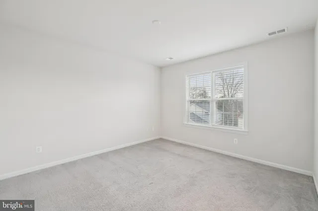 a view of empty room with windows