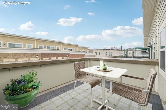 a view of a kitchen with granite countertop a sink and a stove top oven