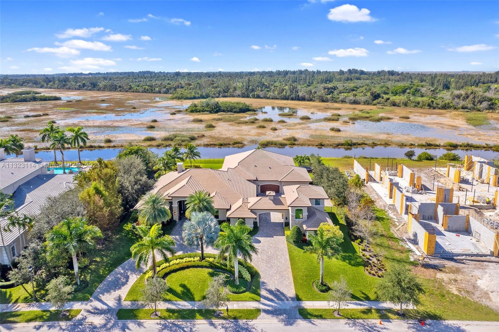 2863 Lake Ridge Lane Weston, FL 33332 - Photo 1 of 60 an aerial view of residential houses with outdoor space