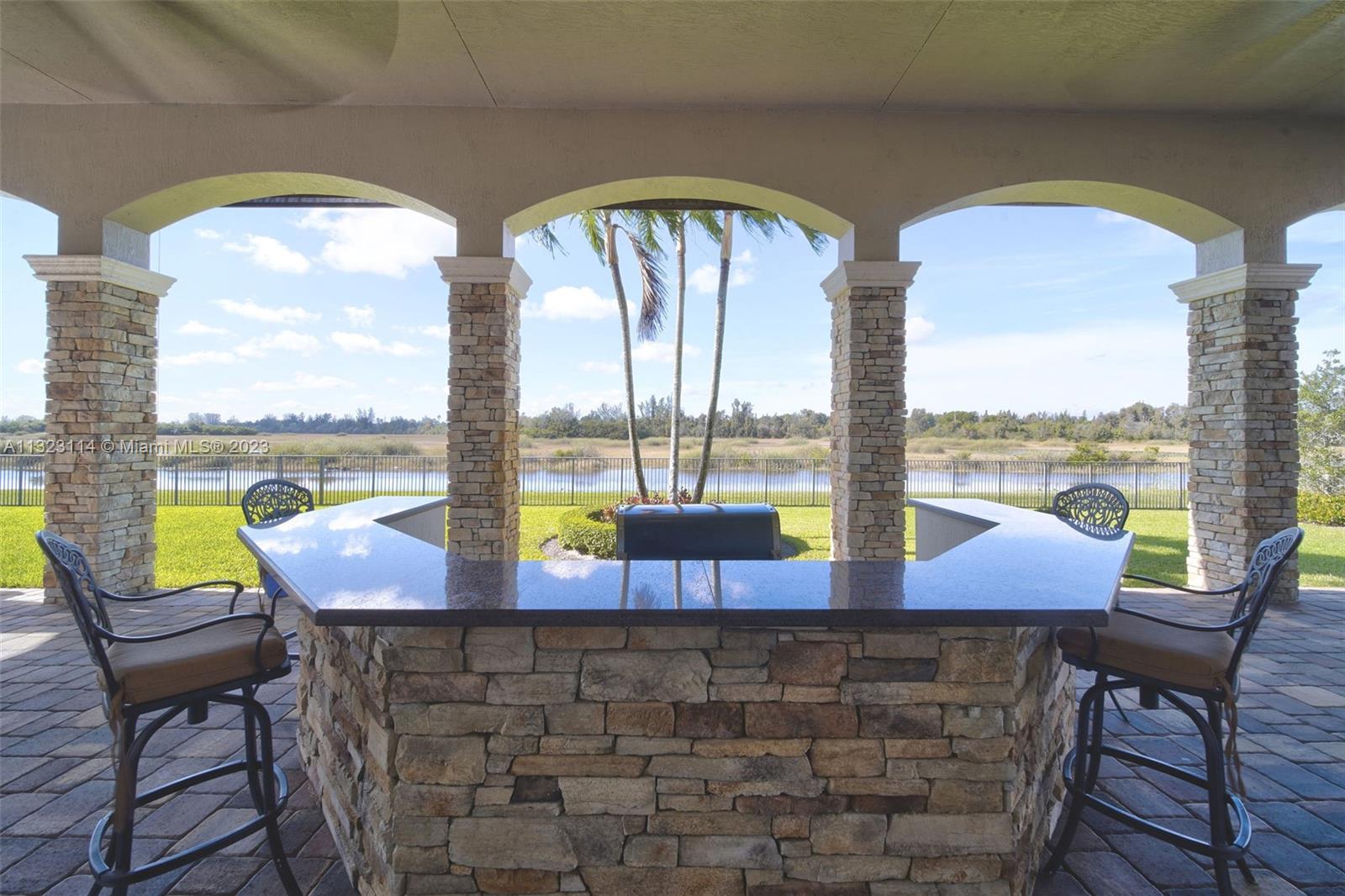 2863 Lake Ridge Lane Weston, FL 33332 - Photo 11 of 60 a view of a swimming pool with outdoor seating and city view