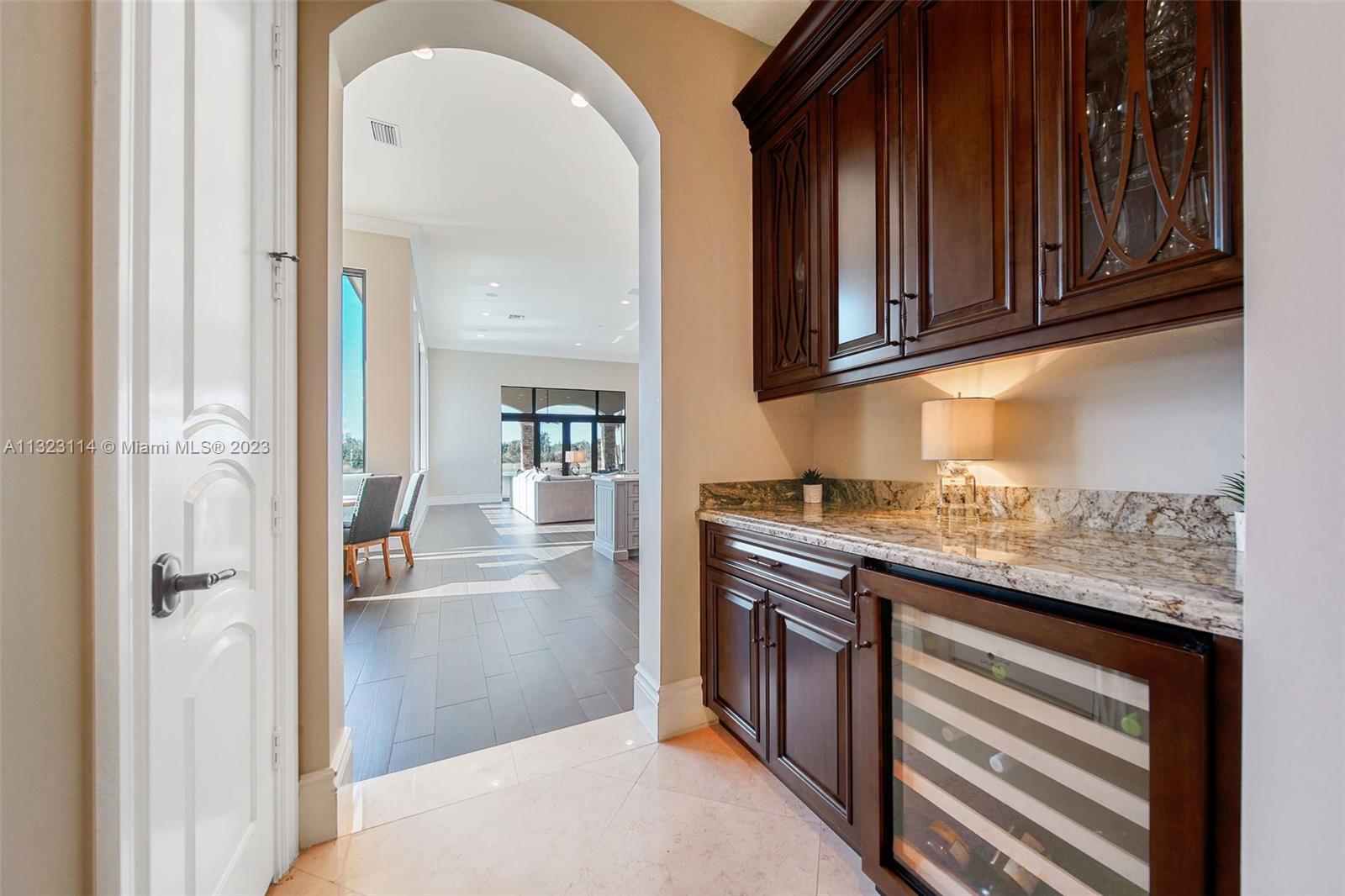 2863 Lake Ridge Lane Weston, FL 33332 - Photo 15 of 60 a kitchen with stainless steel appliances granite countertop a refrigerator and a stove