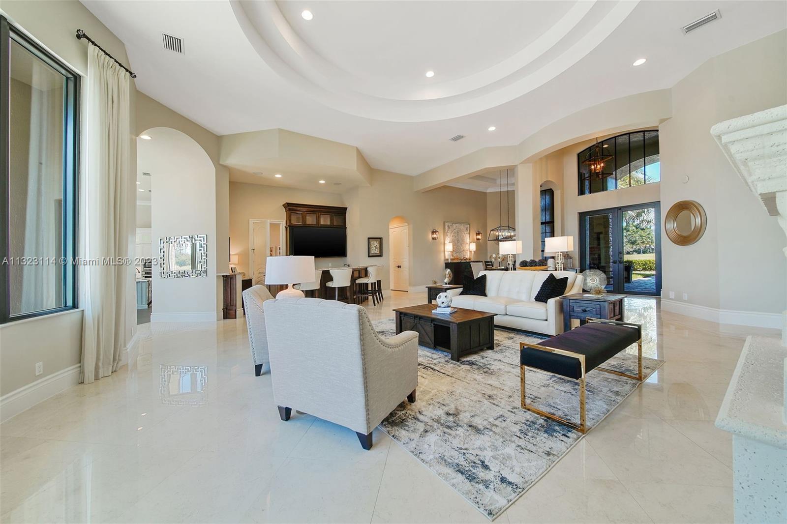 2863 Lake Ridge Lane Weston, FL 33332 - Photo 16 of 60 a living room with furniture and a flat screen tv