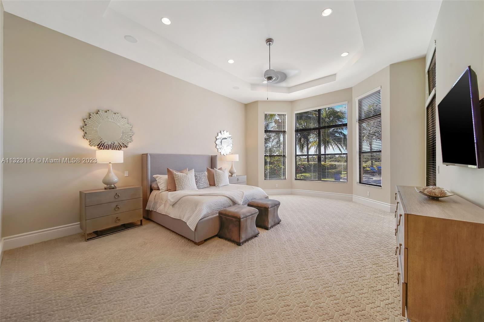 2863 Lake Ridge Lane Weston, FL 33332 - Photo 17 of 60 a bed room with bed and tv