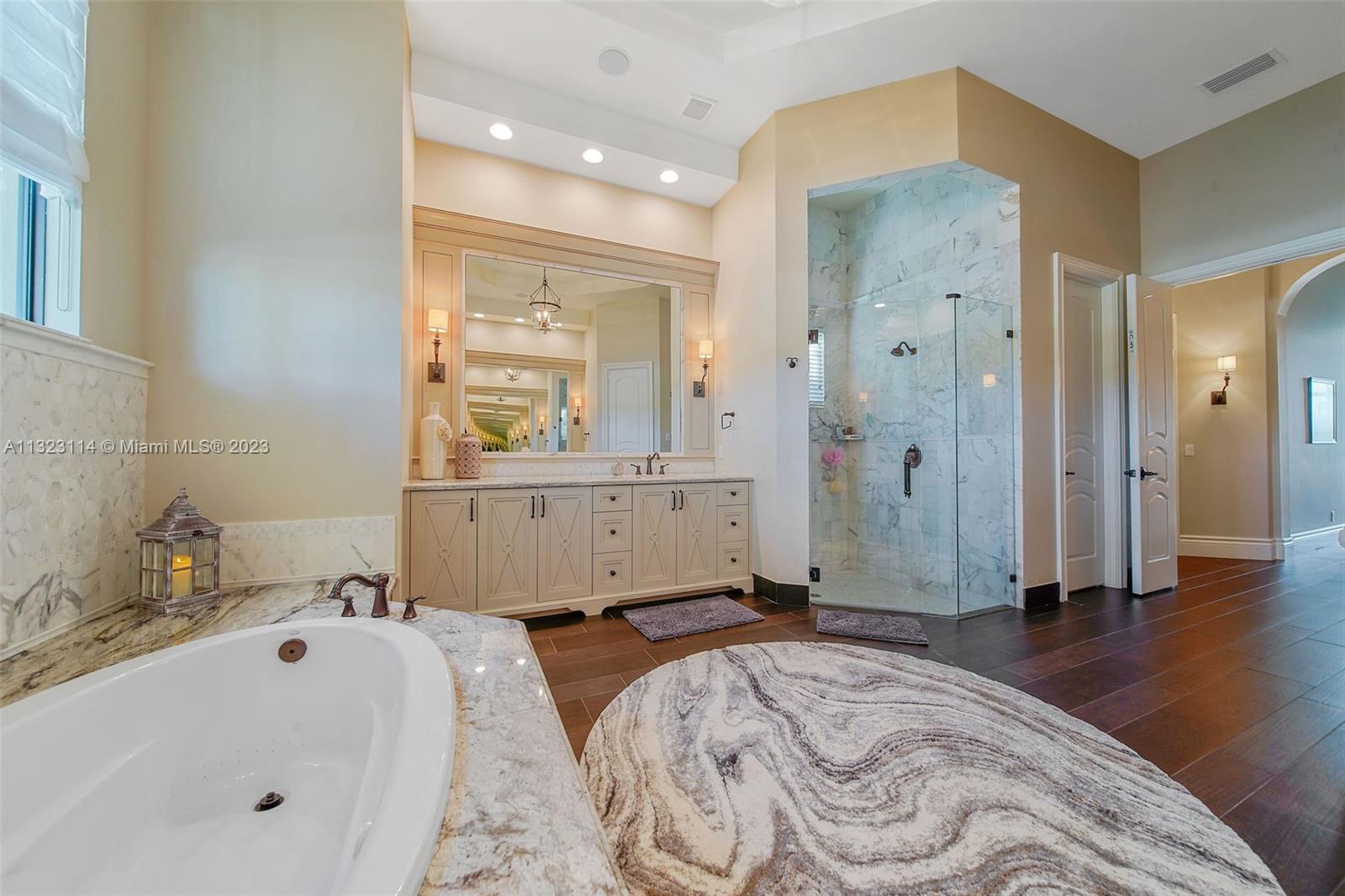 2863 Lake Ridge Lane Weston, FL 33332 - Photo 22 of 60 a bathroom with a tub sink and shower