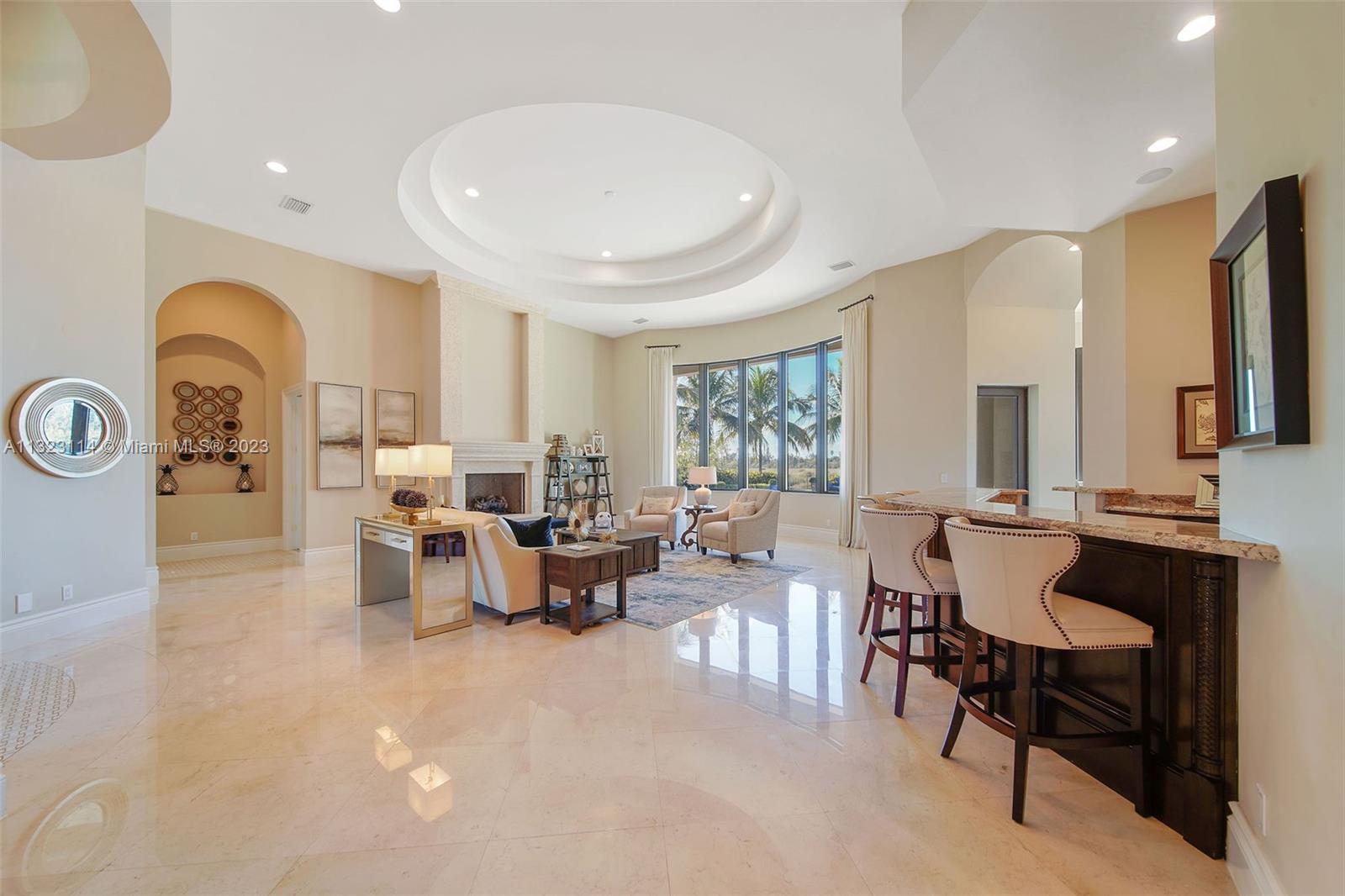 2863 Lake Ridge Lane Weston, FL 33332 - Photo 23 of 60 a living room with furniture and a large window
