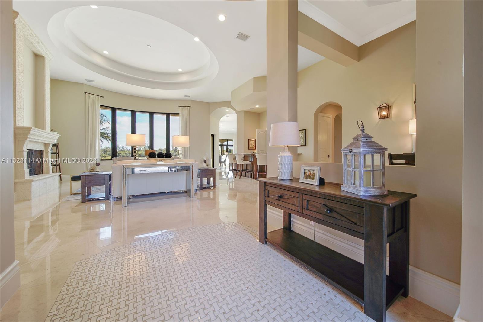 2863 Lake Ridge Lane Weston, FL 33332 - Photo 27 of 60 a living room with fireplace furniture and a window