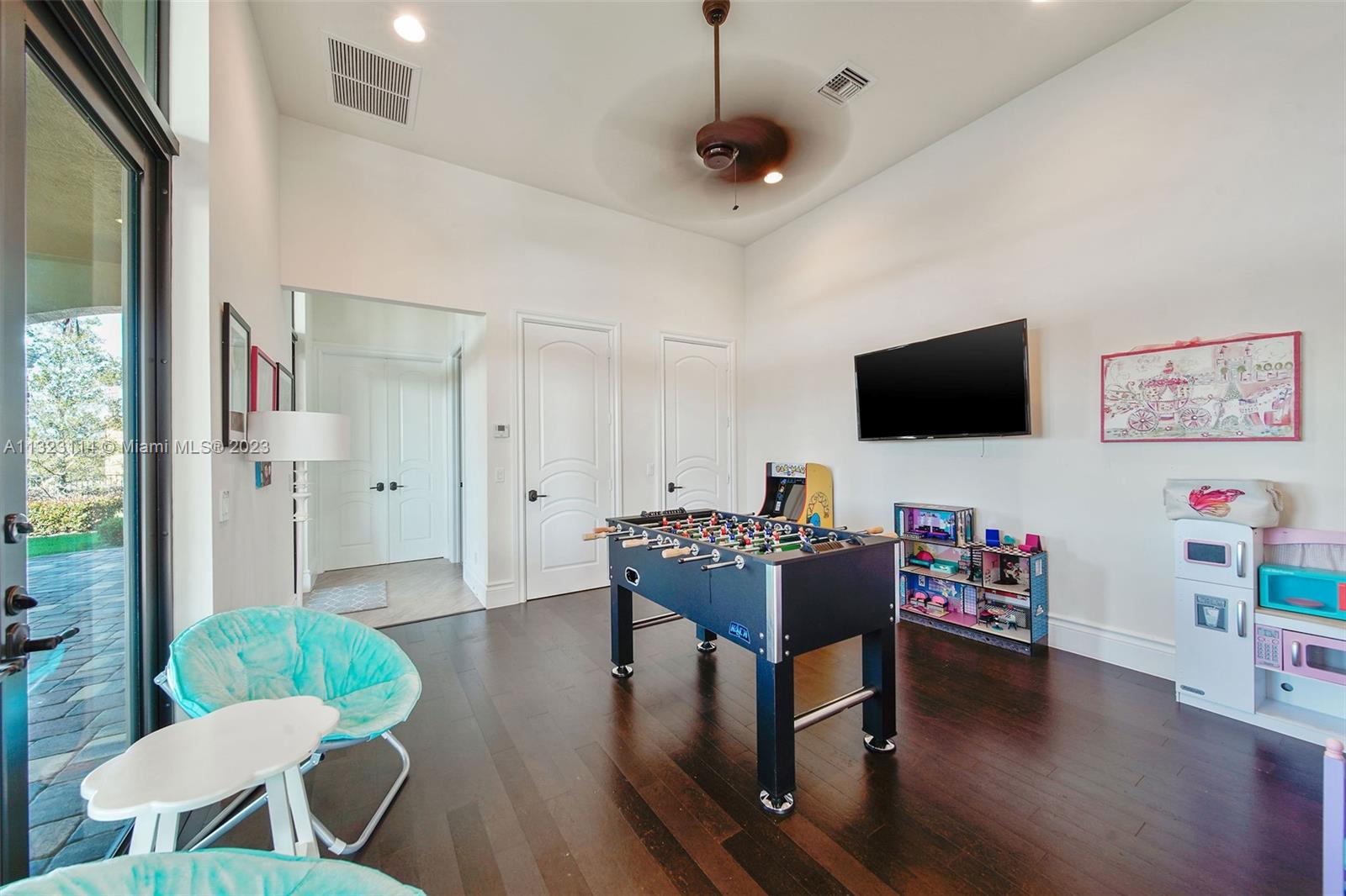 2863 Lake Ridge Lane Weston, FL 33332 - Photo 29 of 60 a living room with furniture and a flat screen tv