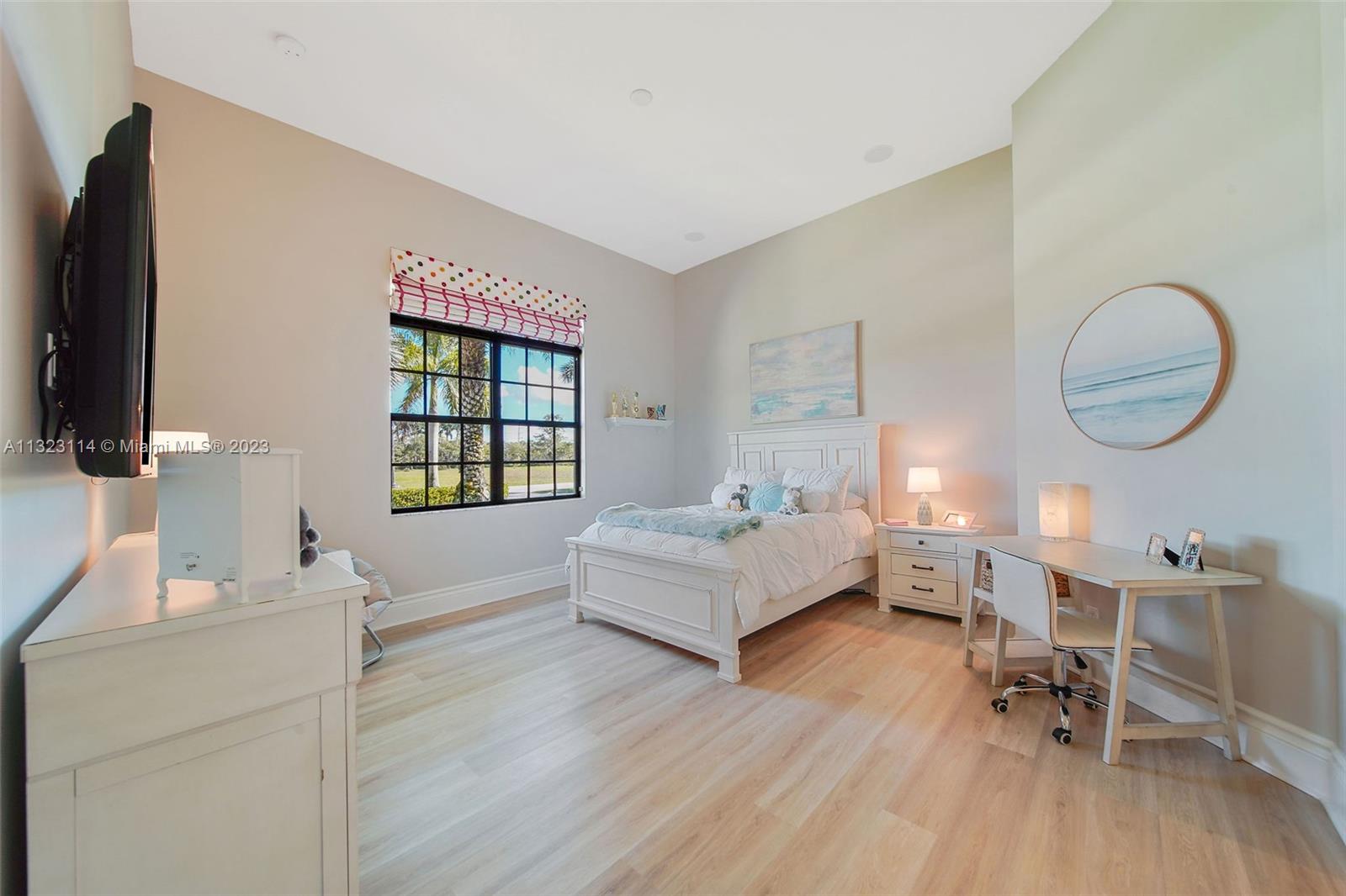 2863 Lake Ridge Lane Weston, FL 33332 - Photo 30 of 60 a living room with furniture and a flat screen tv