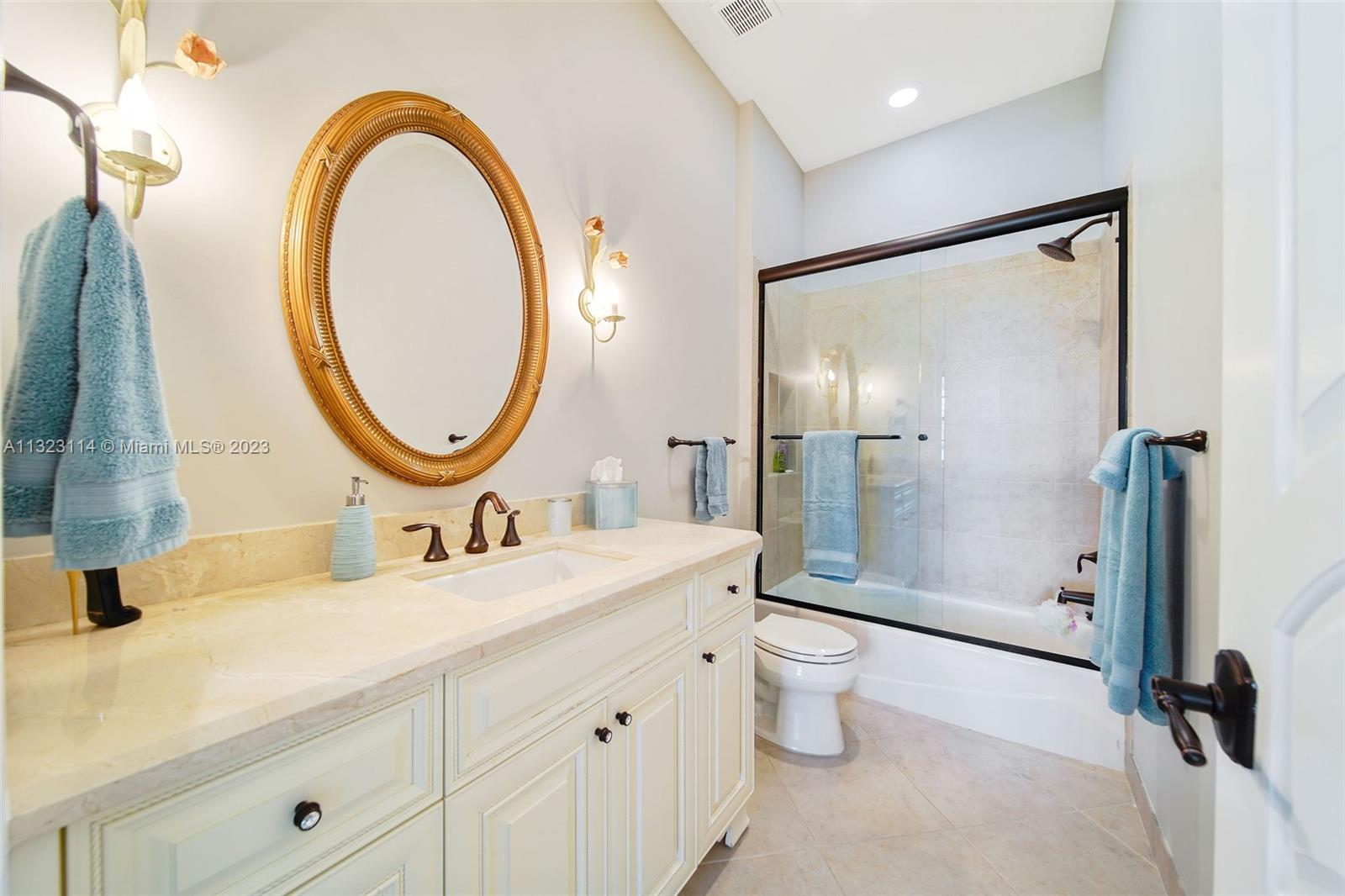 2863 Lake Ridge Lane Weston, FL 33332 - Photo 33 of 60 a bathroom with a double vanity sink toilet mirror and shower