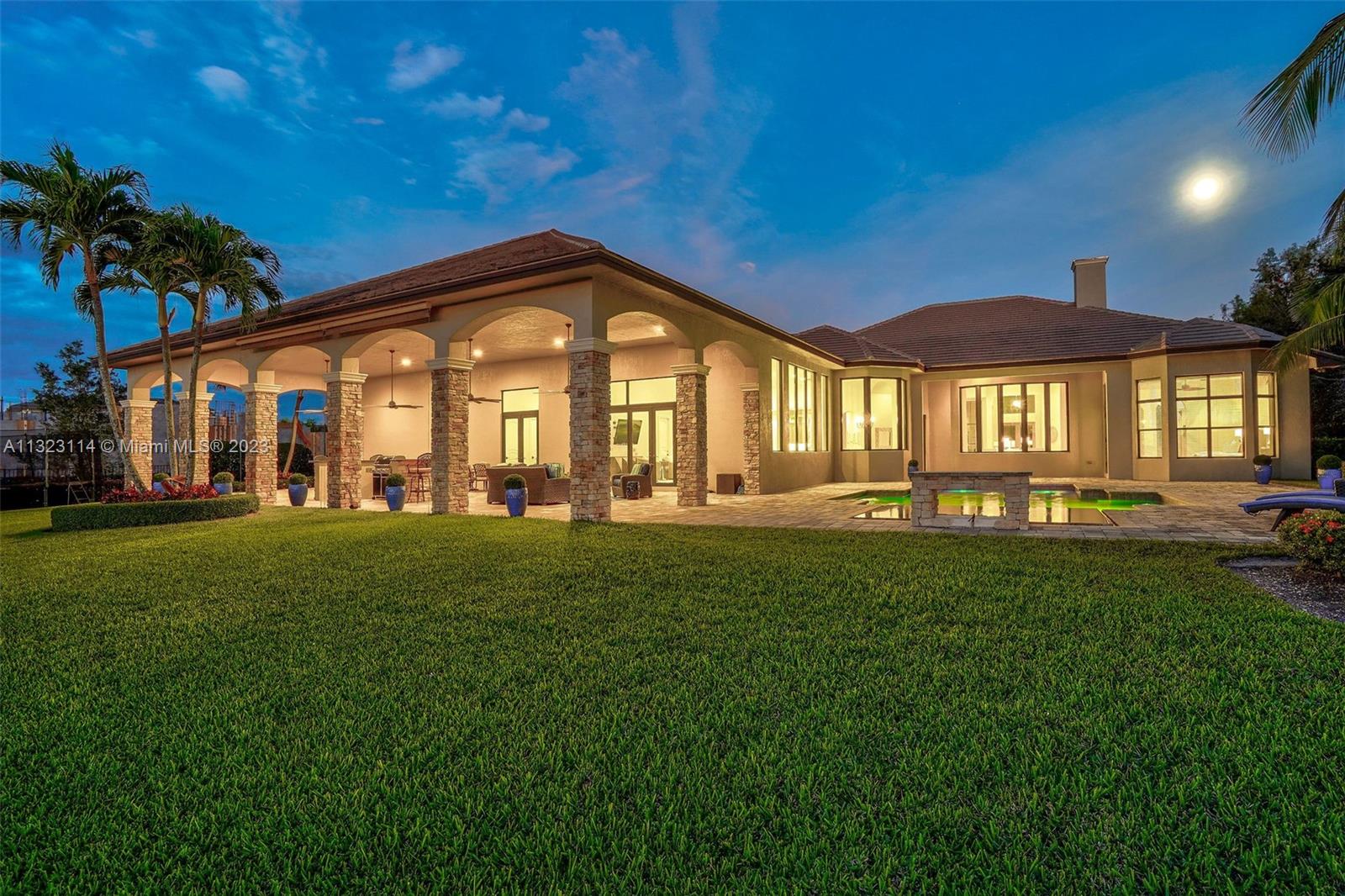 2863 Lake Ridge Lane Weston, FL 33332 - Photo 41 of 60 a front view of a house with a yard