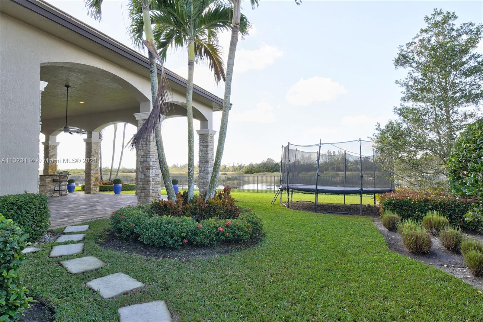 2863 Lake Ridge Lane Weston, FL 33332 - Photo 42 of 60 a view of a garden with a slide