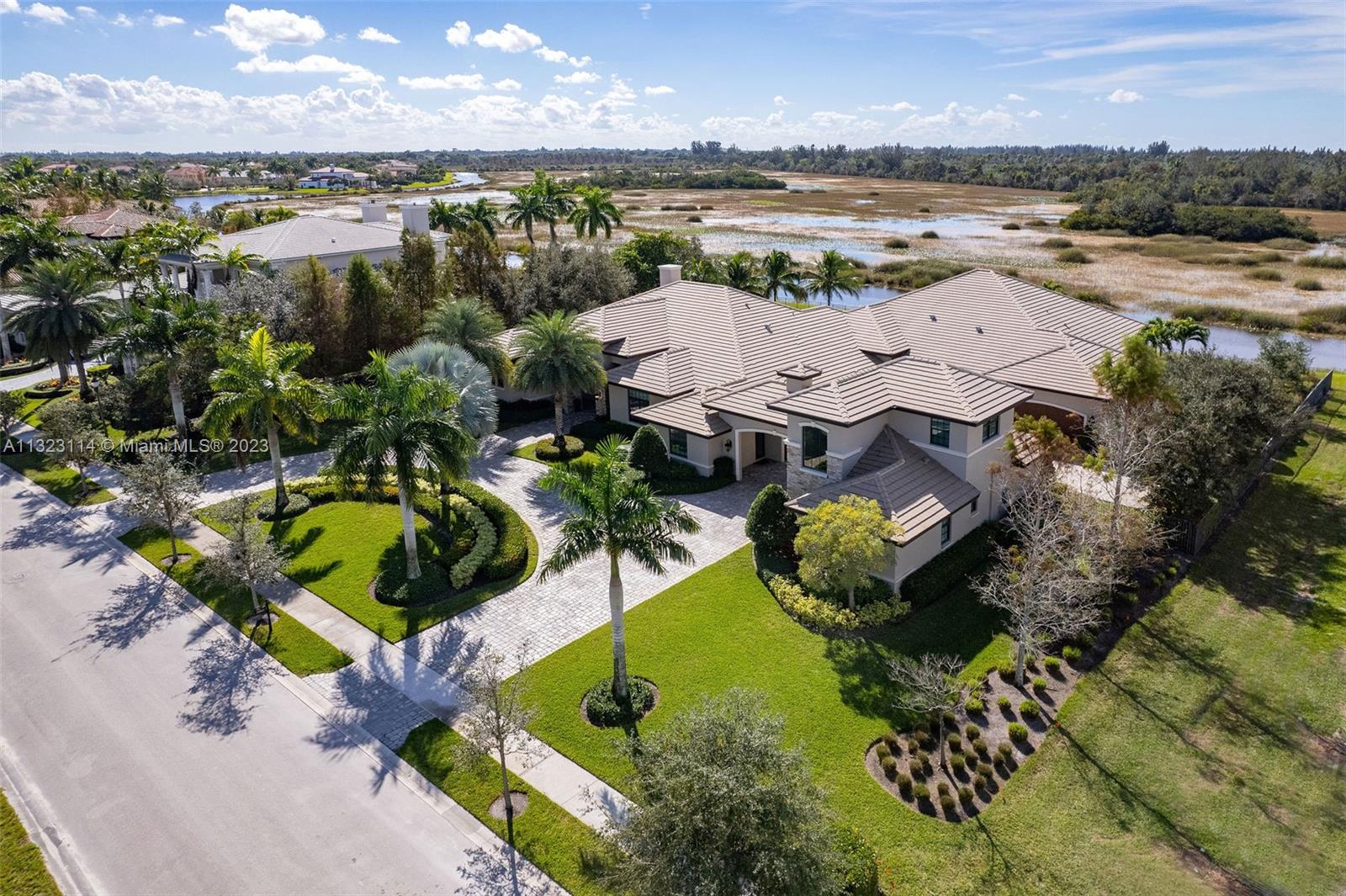 2863 Lake Ridge Lane Weston, FL 33332 - Photo 43 of 60 an aerial view of multiple house with outdoor space