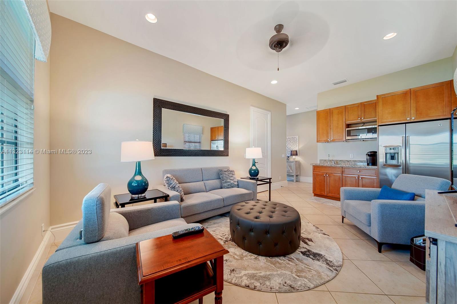 2863 Lake Ridge Lane Weston, FL 33332 - Photo 48 of 60 a living room with furniture and a rug