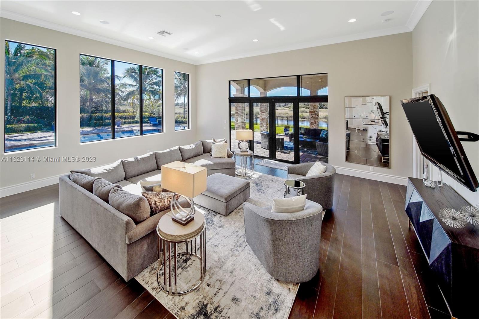 2863 Lake Ridge Lane Weston, FL 33332 - Photo 55 of 60 a living room with furniture and a large window