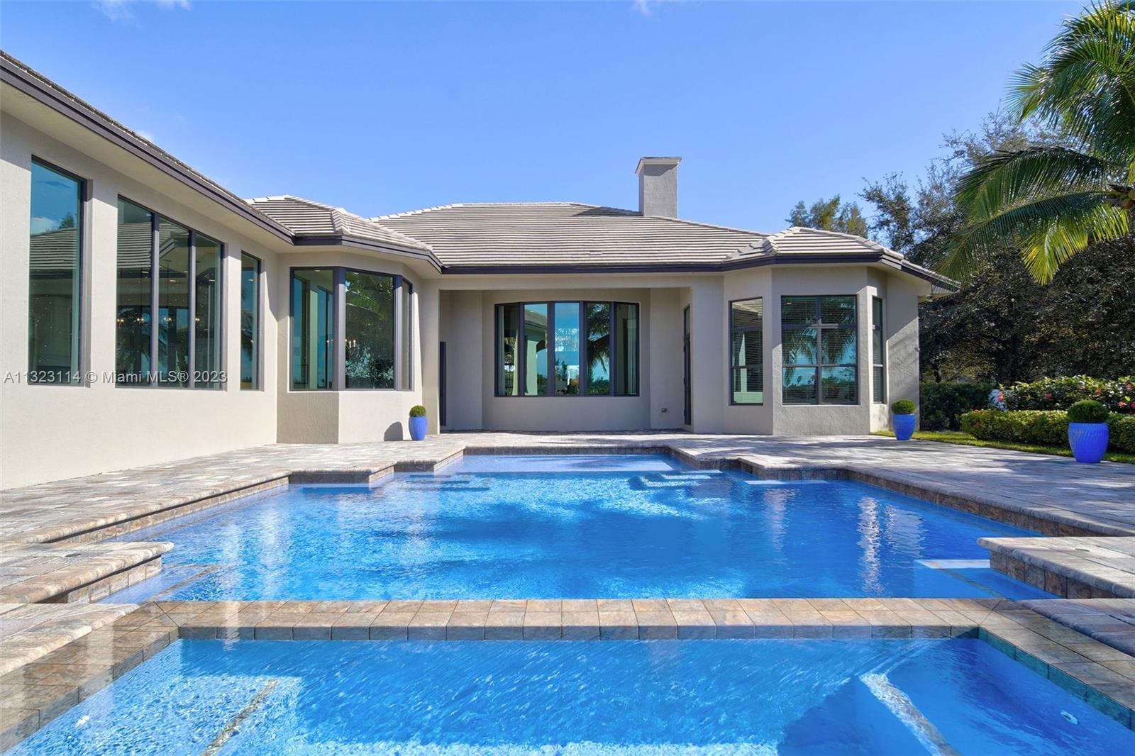 2863 Lake Ridge Lane Weston, FL 33332 - Photo 56 of 60 a view of a house with pool and porch