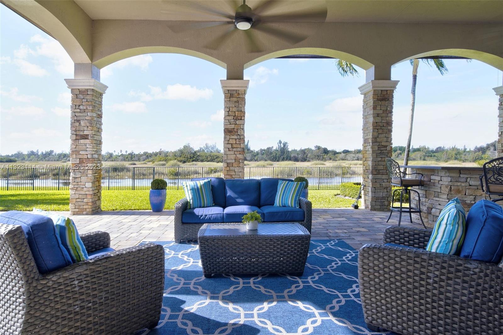 2863 Lake Ridge Lane Weston, FL 33332 - Photo 57 of 60 a view of swimming pool with outdoor seating and ocean view