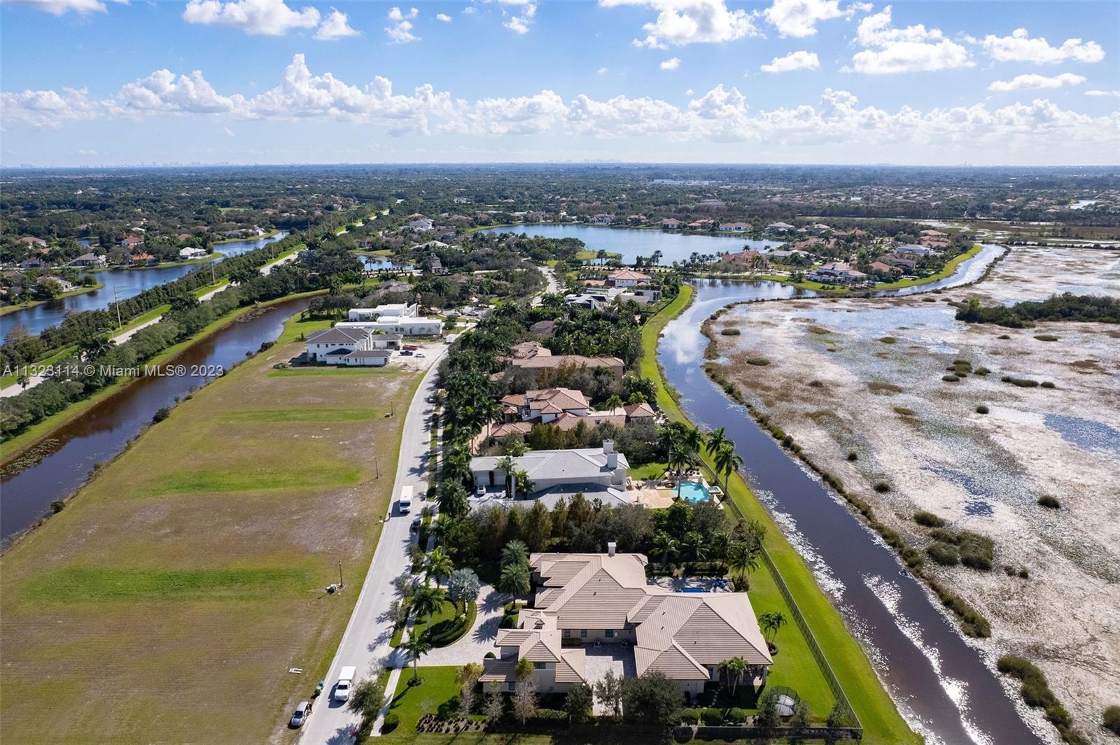 2863 Lake Ridge Lane Weston, FL 33332 - Photo 58 of 60 an aerial view of residential houses with outdoor space