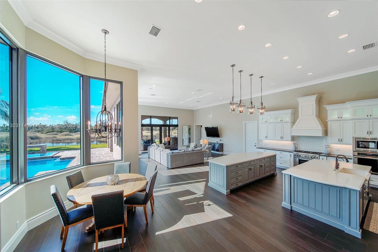 2863 Lake Ridge Lane Weston, FL 33332 - Photo 7 of 60 a view of a dining room with furniture window and wooden floor