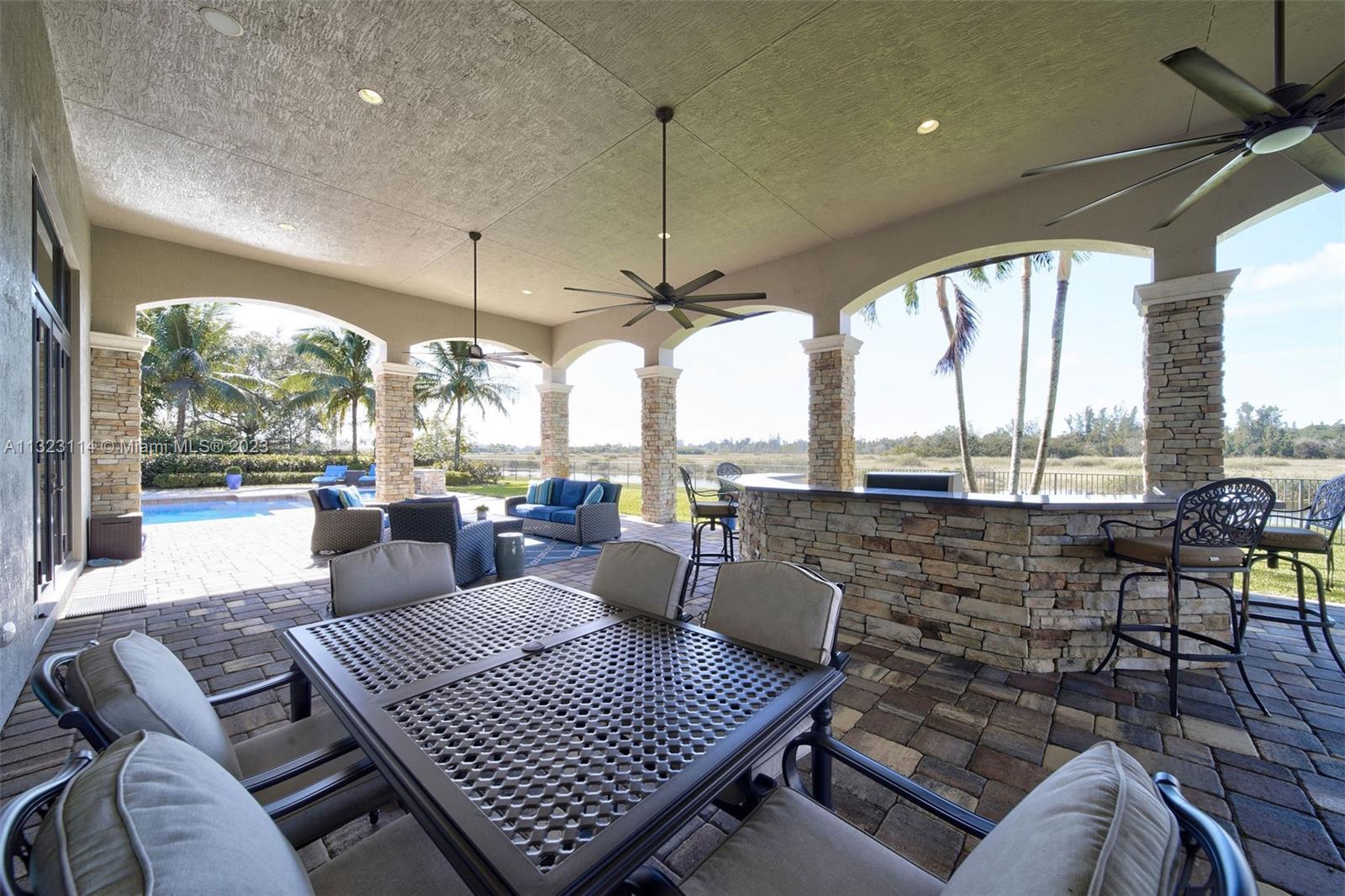 2863 Lake Ridge Lane Weston, FL 33332 - Photo 10 of 60 a living room with furniture floor to ceiling window and outdoor view