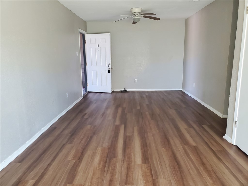1102 Denver Street, Unit B Portland, TX 78374 - Photo 2 of 7 wooden floor in a hall with an entryway
