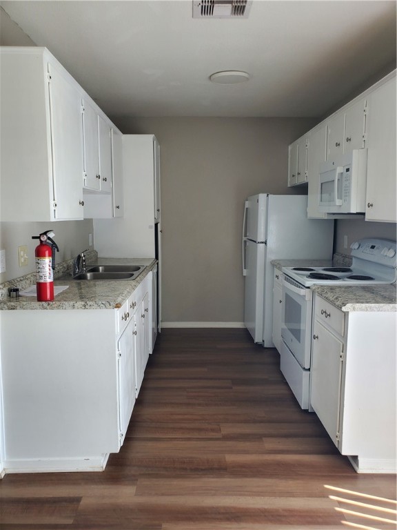 1102 Denver Street, Unit B Portland, TX 78374 - Photo 5 of 7 a kitchen with sink cabinets and wooden floor