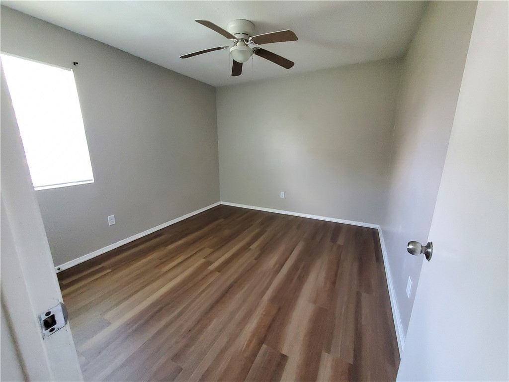 1102 Denver Street, Unit B Portland, TX 78374 - Photo 7 of 7 a view of room with a ceiling fan and window