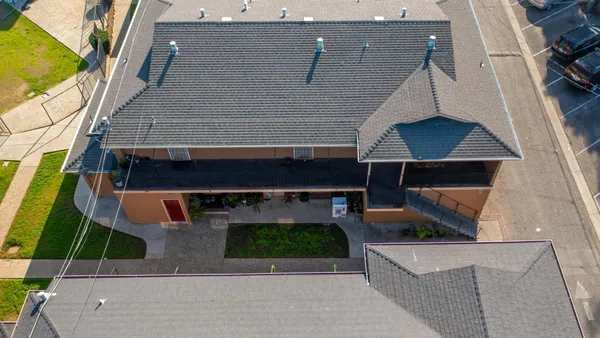 an aerial view of a house with a garden