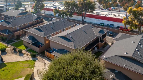 a aerial view of a house with swimming pool