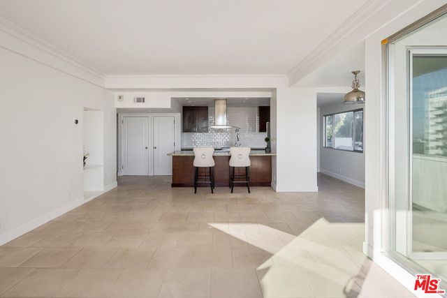 a living room with furniture and window