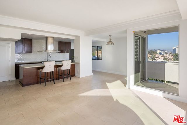 a spacious bedroom with a bed and a table in it