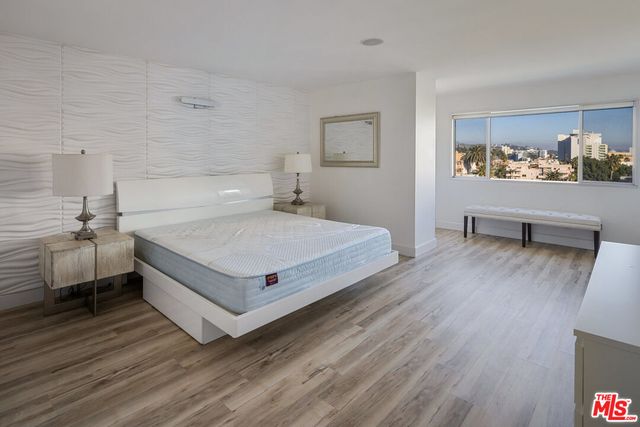 a bedroom with a bed and a view of bathroom