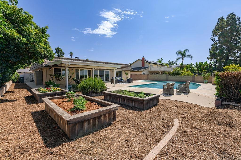 13321 Canyon Back Lane Poway, CA 92064 - Photo 19 of 26 a view of a house with pool and chairs